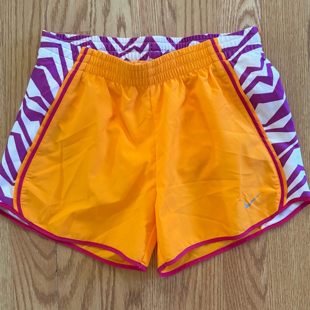 Nike Orange Athletic Shorts with Purple Zigzag Design